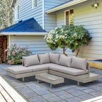 Salon de jardin d'angle gris clair installé sur une terrasse